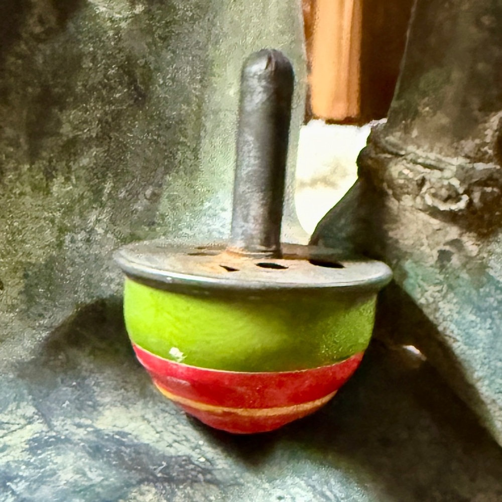 Vintage Metal Spinning Top with Green and Red Stripes